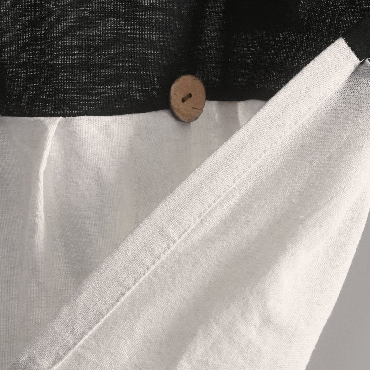 Close-up of the Linen Button Valance showcasing pleats, buttons, and natural fabric texture in a farmhouse style.