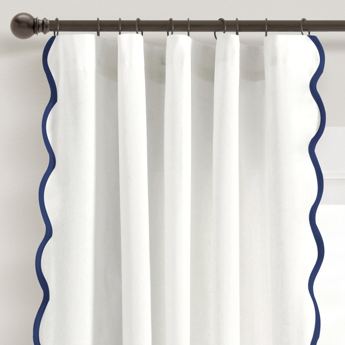 Coastal Chic Scalloped Edge Window Curtain Panel Set featuring a white fabric with a navy scallop edge design.