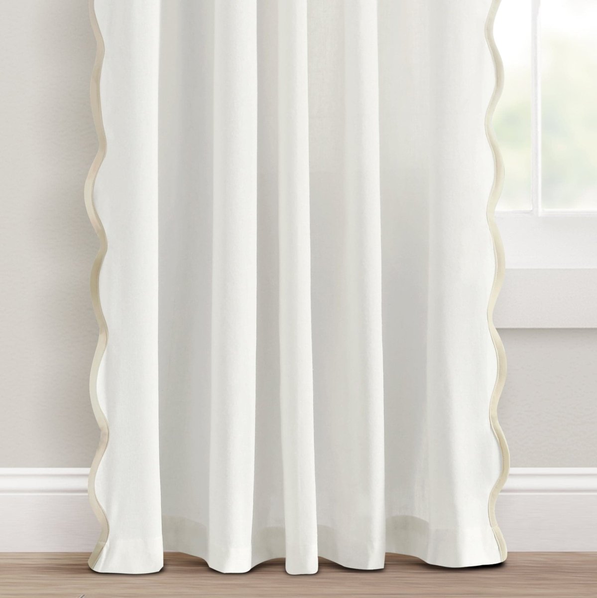 Coastal Chic Scalloped Edge Window Curtain Panel Set hanging in a bright room with scallop detailing.