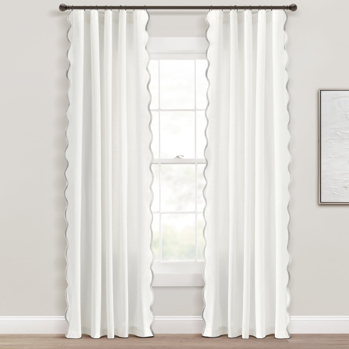 Coastal Chic Scalloped Edge Window Curtain Panel Set styled in a bright room framing a window.
