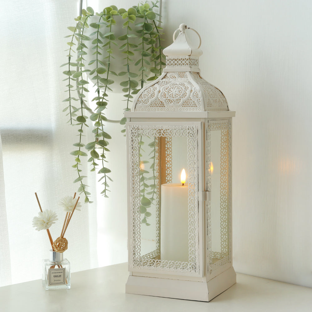 Rustic Metal Decorative Candle Lantern Hanging Candle Holder with Tempered Glass White placed decoratively with a candle inside.