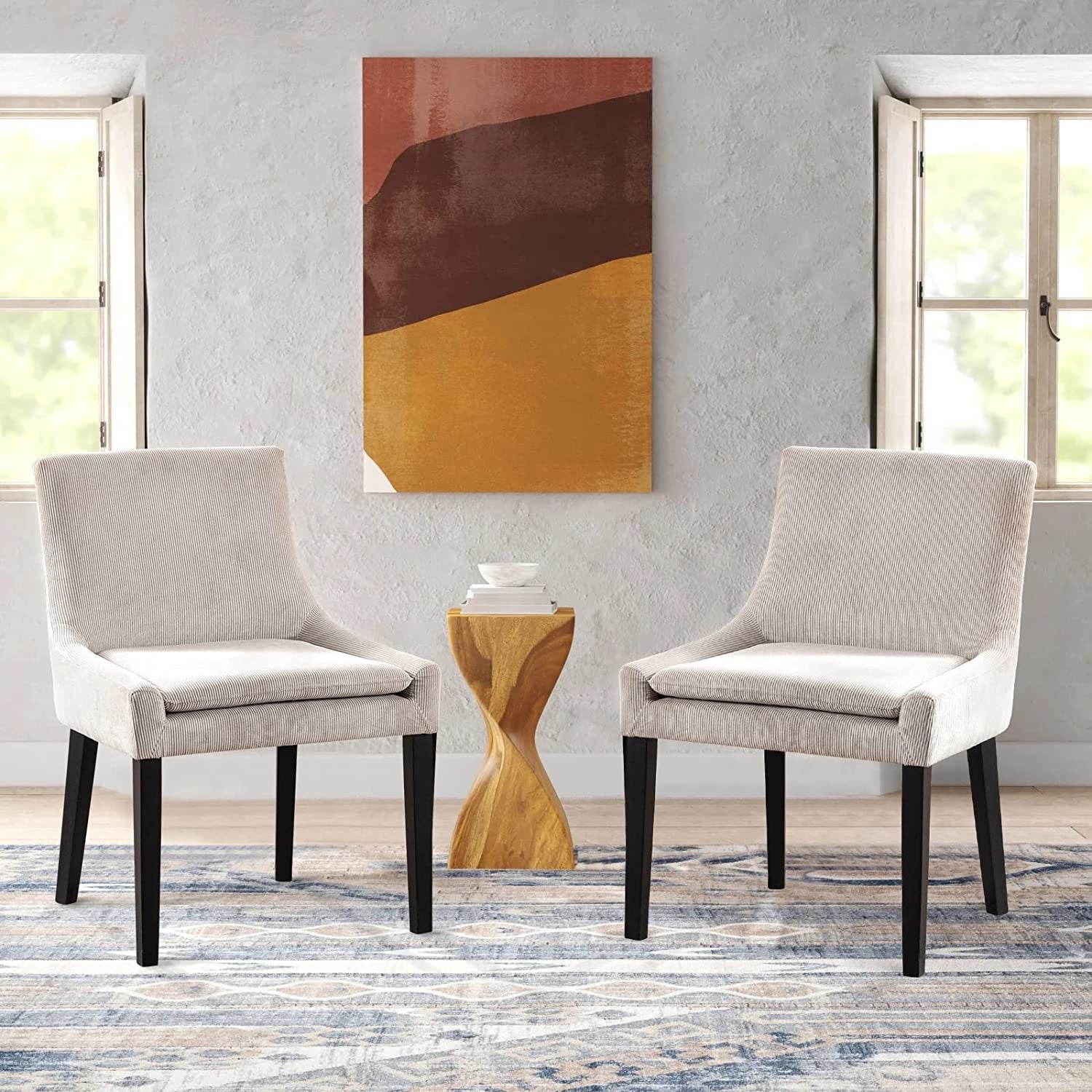 Beige Corduroy Dining Chairs With Wood Legs Set Of 6 in a stylish dining room setting with art and wood accent table.