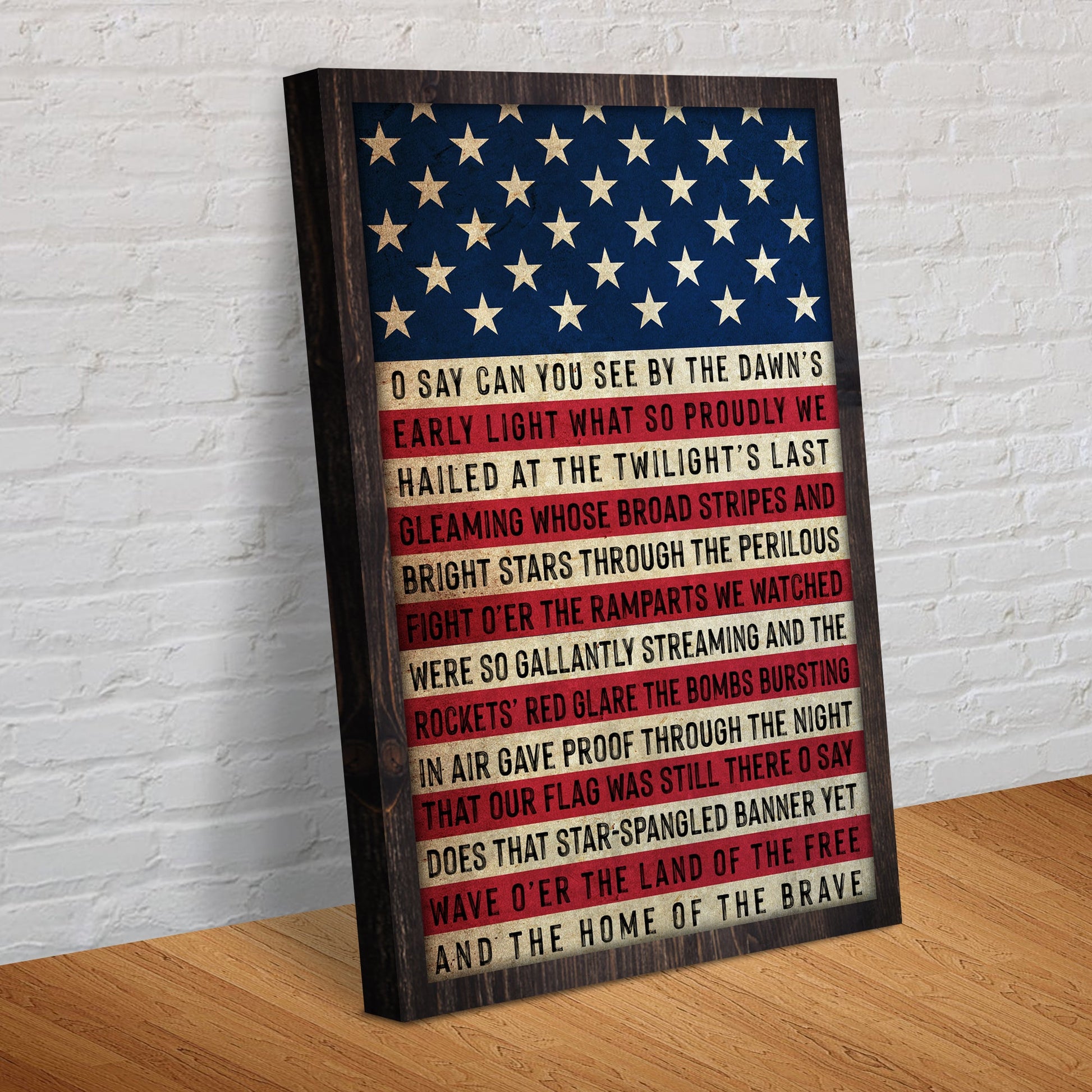Decorative wall art with American flag design and text on a wooden surface.