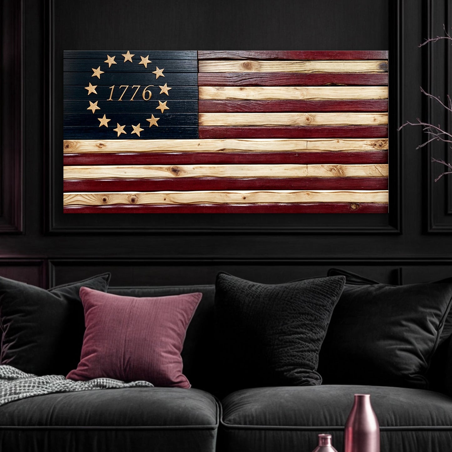 Wooden flag with '1776' and star design in a dark room with a sofa and decorative pillows.