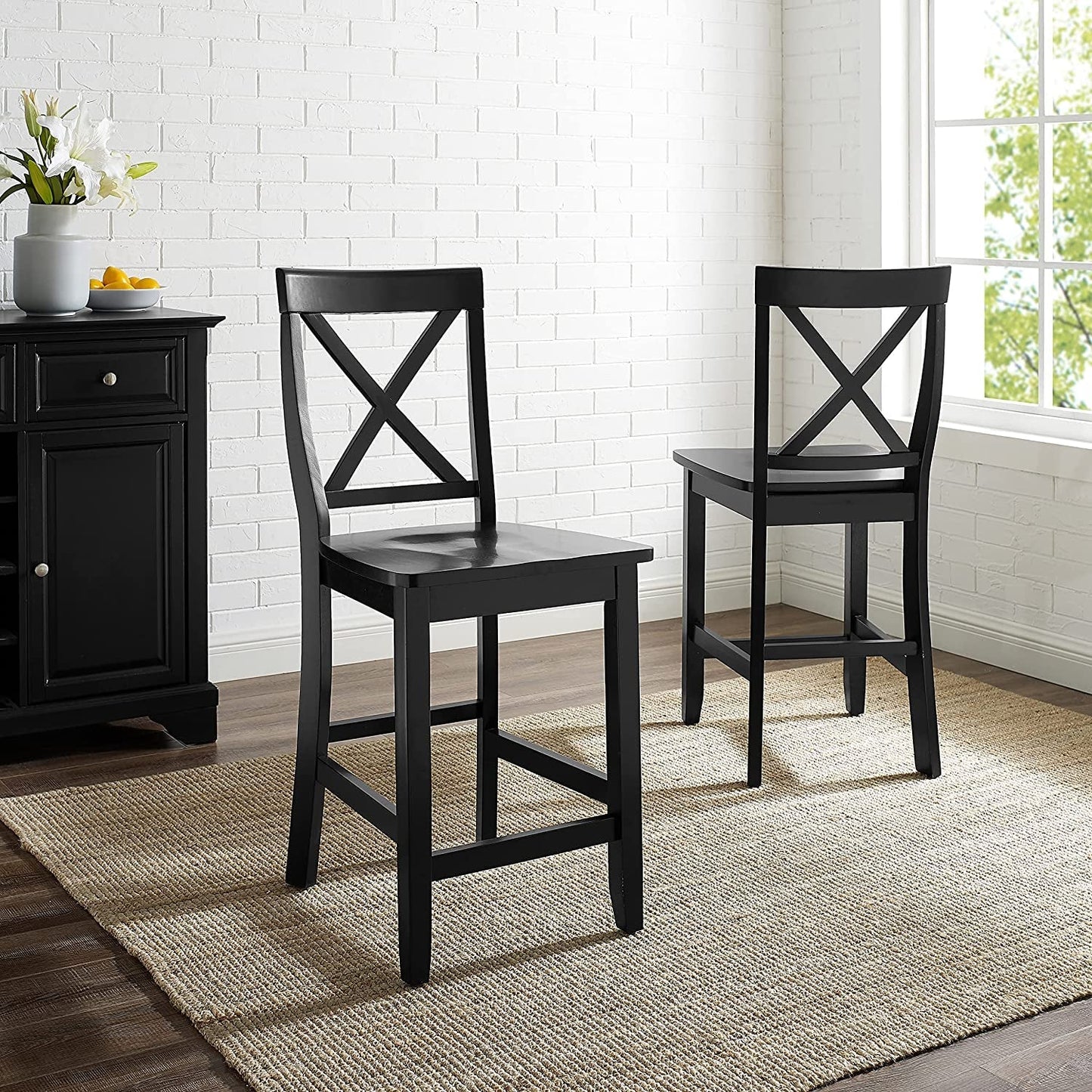 24 Inch X Back Bar Stool Set With Contoured Seat Ergonomic placed in a modern dining room with a light rug.