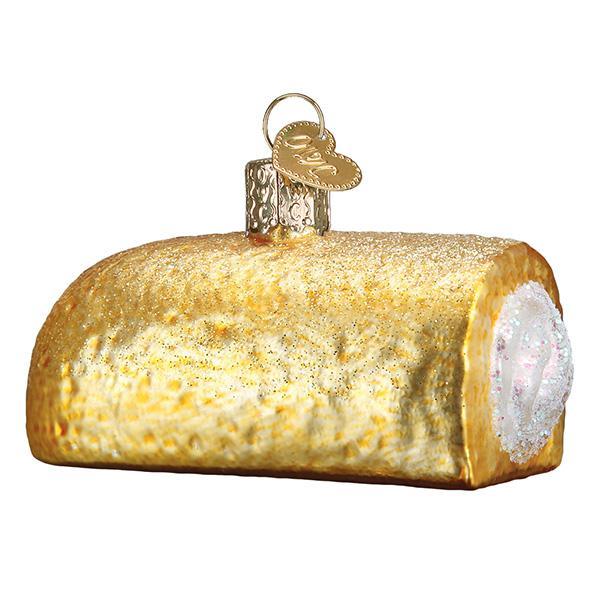 Decorative glass ornament shaped like a Twinkie with gold and white finish on a white background