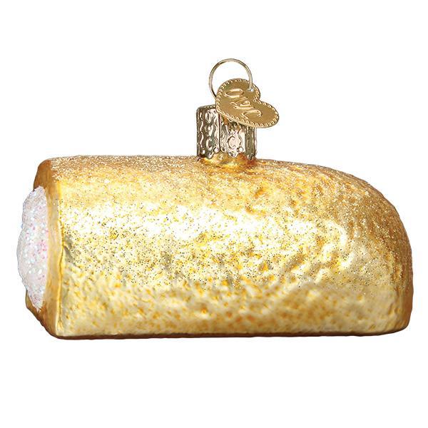 Decorative glass ornament shaped like a Twinkie with a gold top on a white background