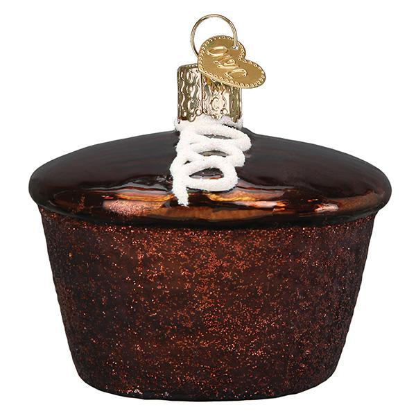 Decorative ornament resembling a Hostess cupcake with frosting, on a white background