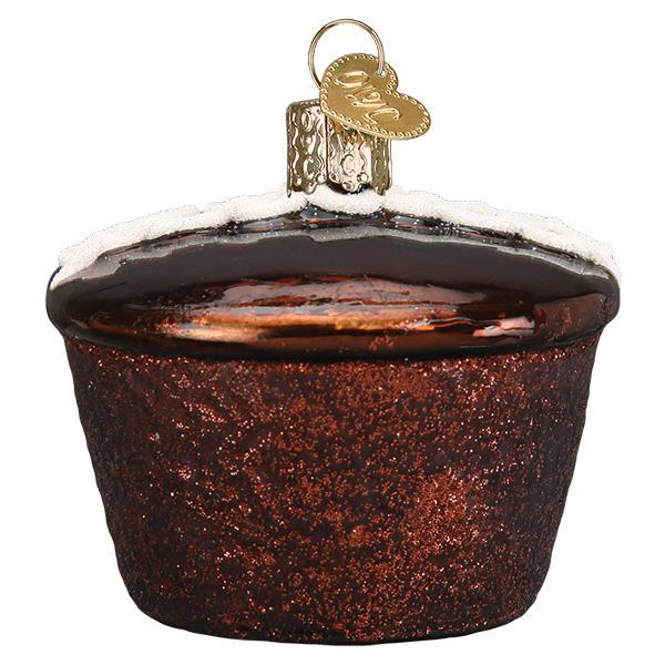 Decorative glass ornament shaped like a cupcake with a gold tag on a white background