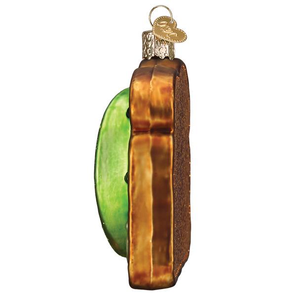 Decorative glass ornament with green and brown striped design on a white background