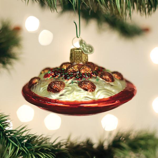 Spaghetti and Meatballs Ornament hanging on a Christmas tree with colorful lights.