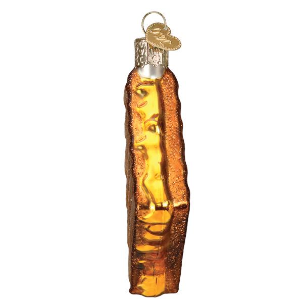 Glass ornament shaped like a grilled cheese sandwich with a label on a white background
