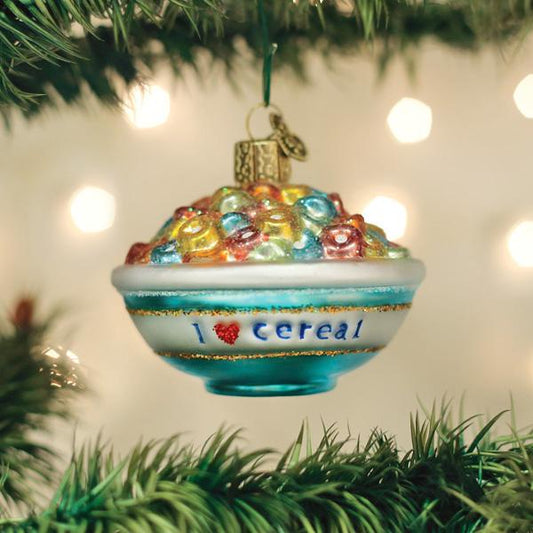 Christmas ornament shaped like a bowl of cereal with colorful pieces on a tree.