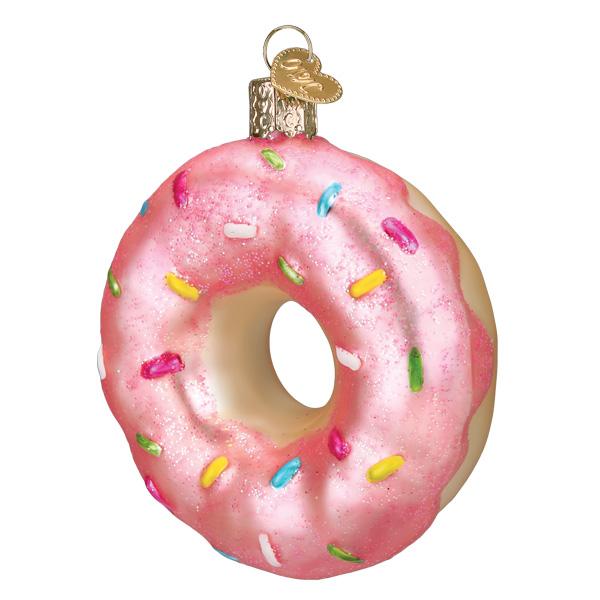 Decorative donut ornament with pink icing and colorful sprinkles on a white background