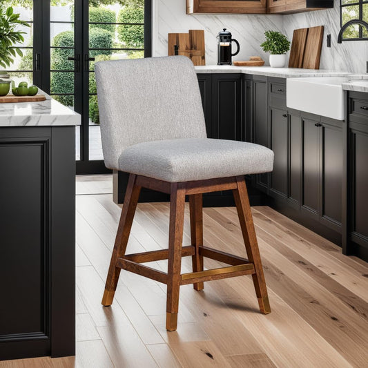 Basila 26 Inch Seat Height Swivel Bar Stool Taupe Fabric in modern kitchen setting with wood accents.