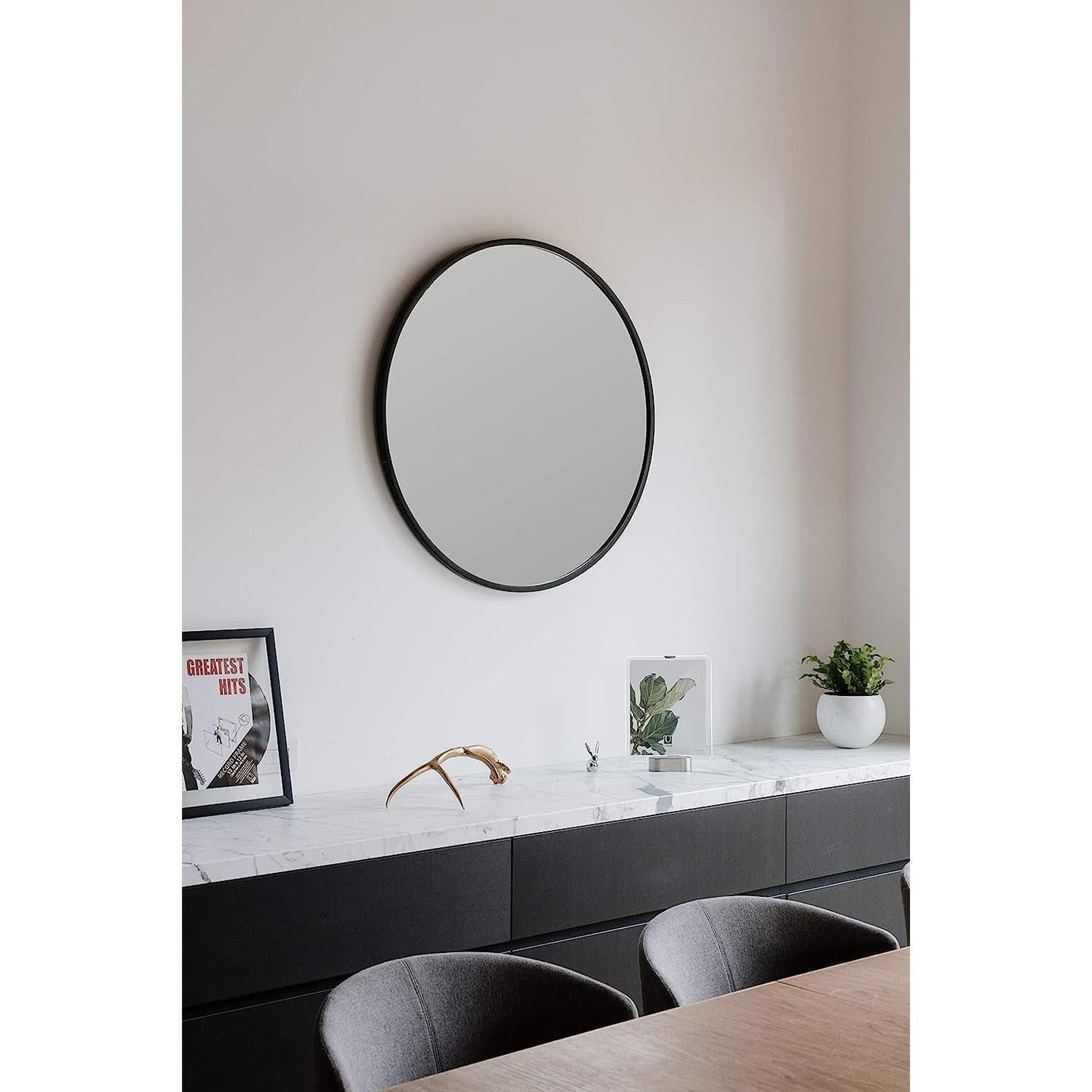 Round Rubber Wall Mirror 37 Inch diameter with protective rubber frame elegantly displayed in a modern living space.