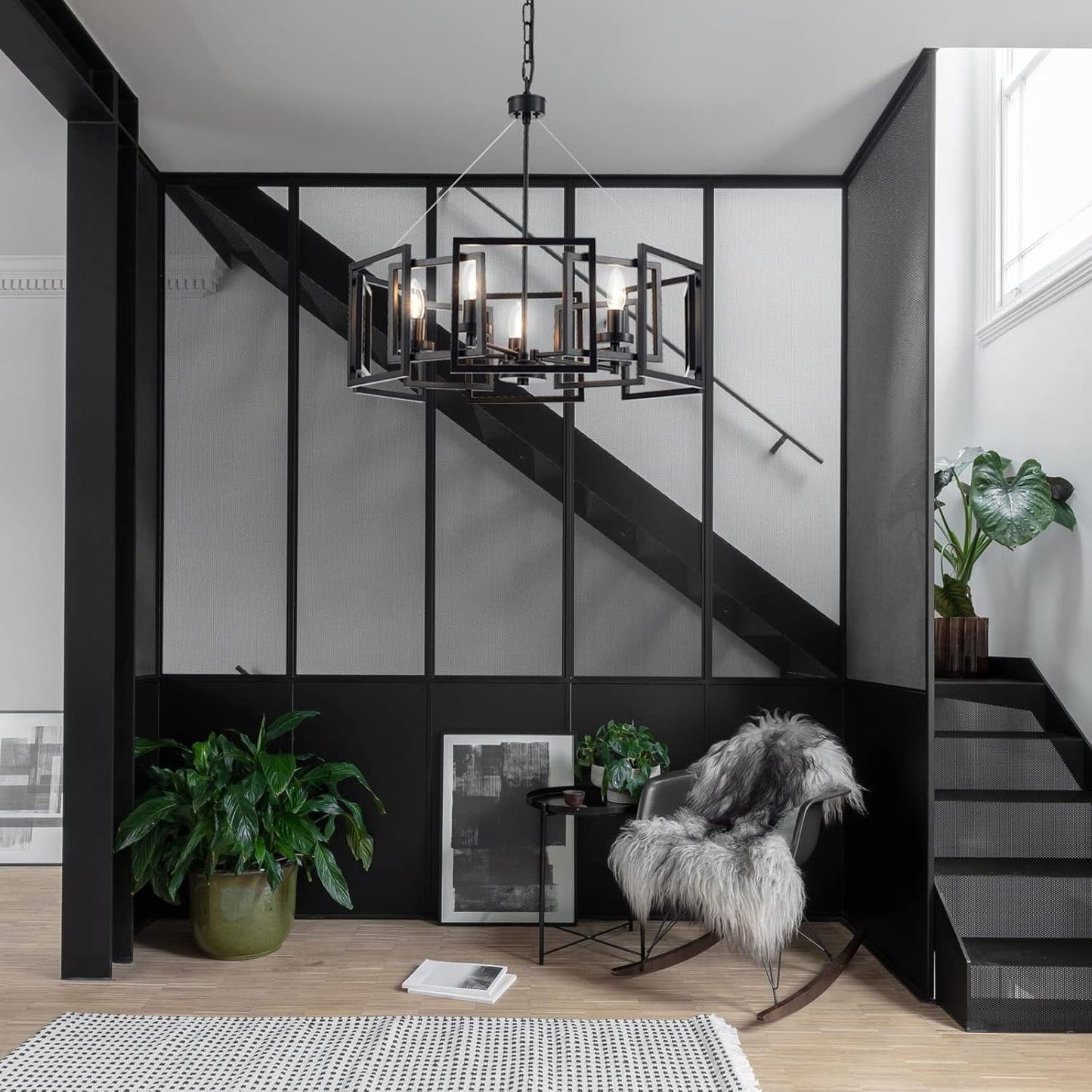 Industrial Style Five Light Matte Black Pendant Chandelier creating a modern glow in a stylish interior with black accents.