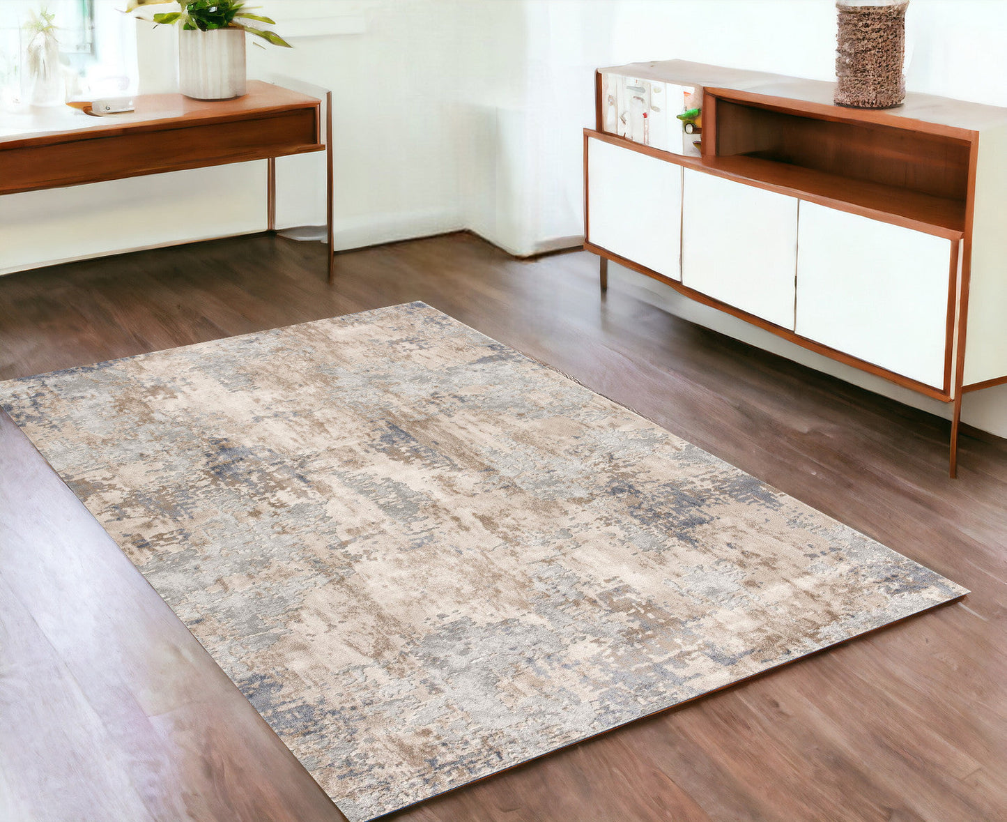 7' X 10' Beige And Ivory Abstract Area Rug