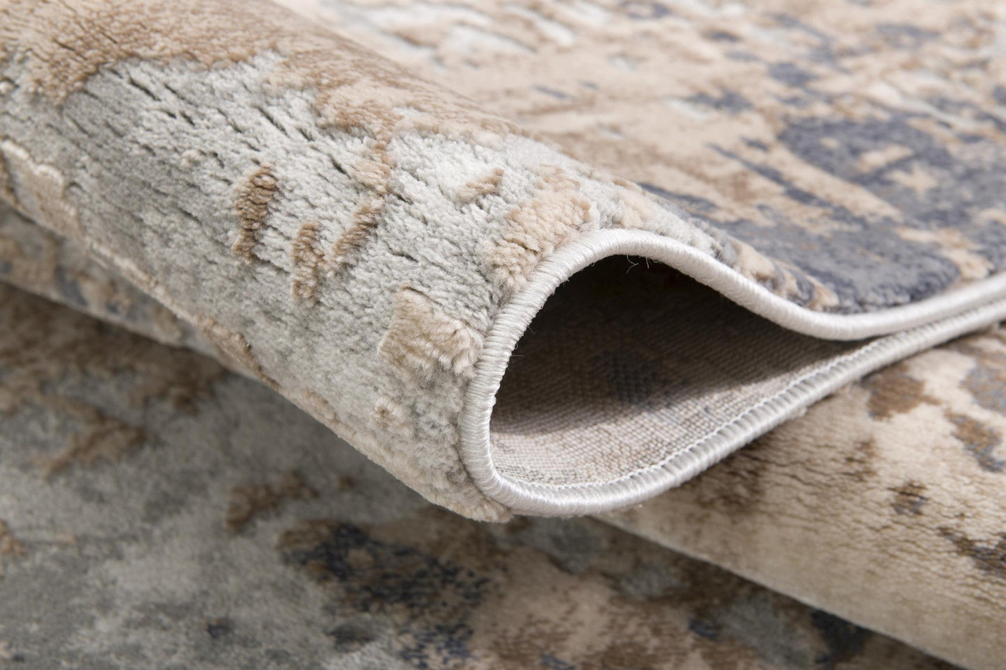 7' X 10' Beige And Ivory Abstract Area Rug