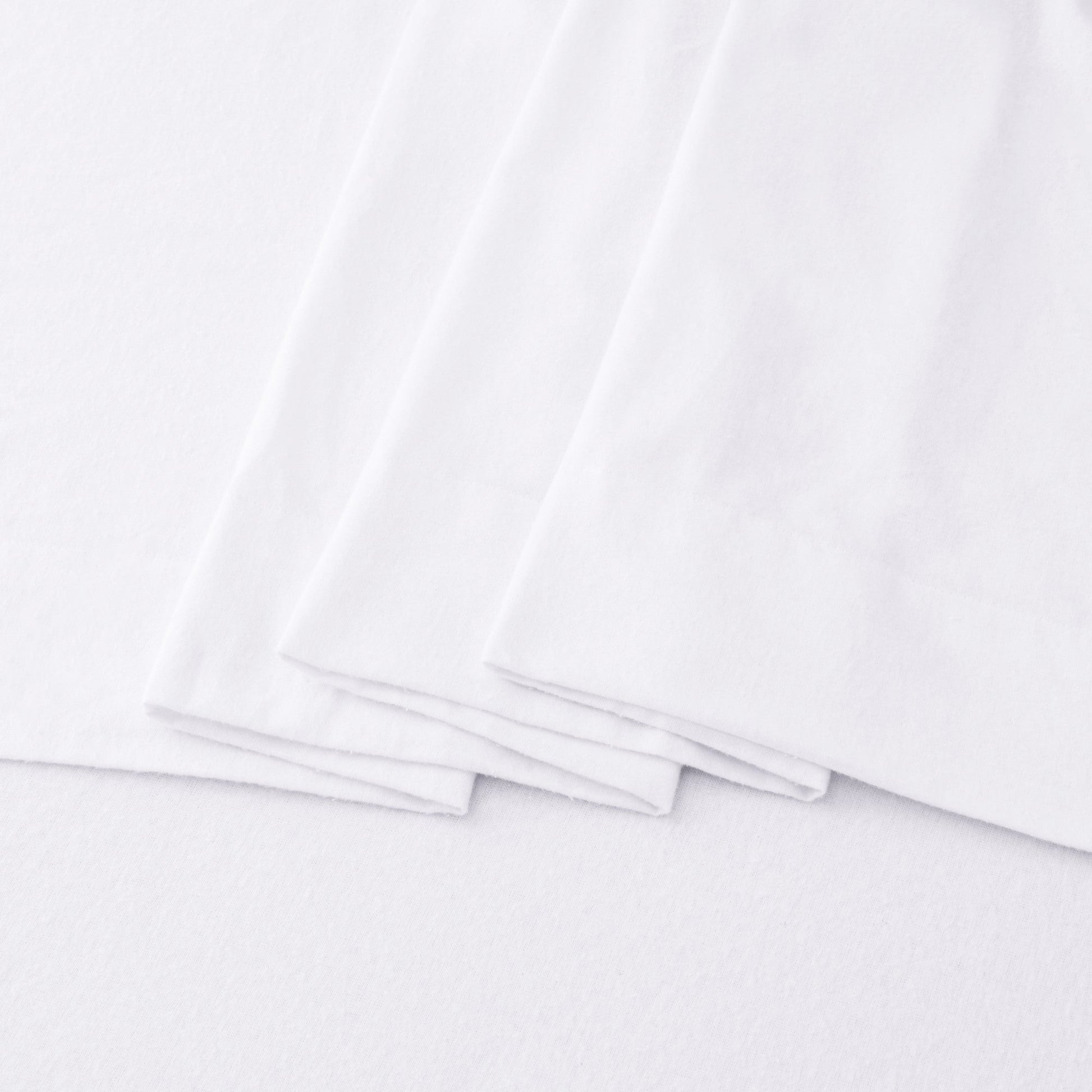 Stack of white sheets on a white background