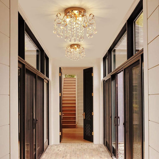 Small Gold Crystal Chandelier Three Light G9 Modern Design illuminating a stylish hallway with elegant decor.