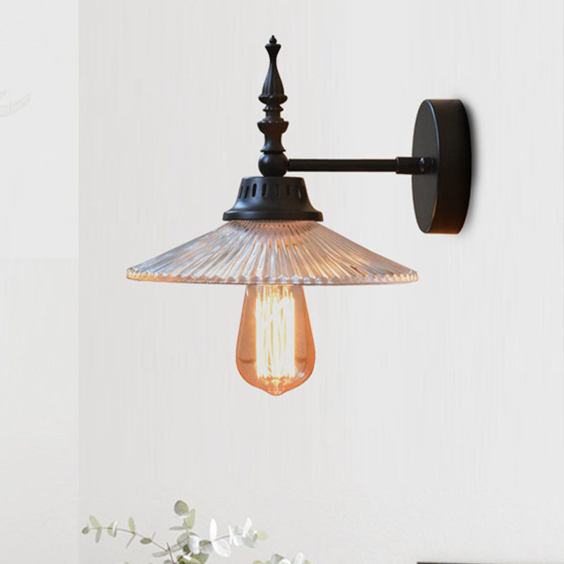Light Up Your Space with Industrial Chic: The 1-Light Black Sconce with Clear/Green Glass