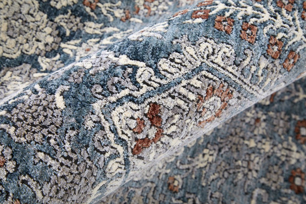 7' X 10' Blue And Ivory Floral Power Loom Stain Resistant Area Rug