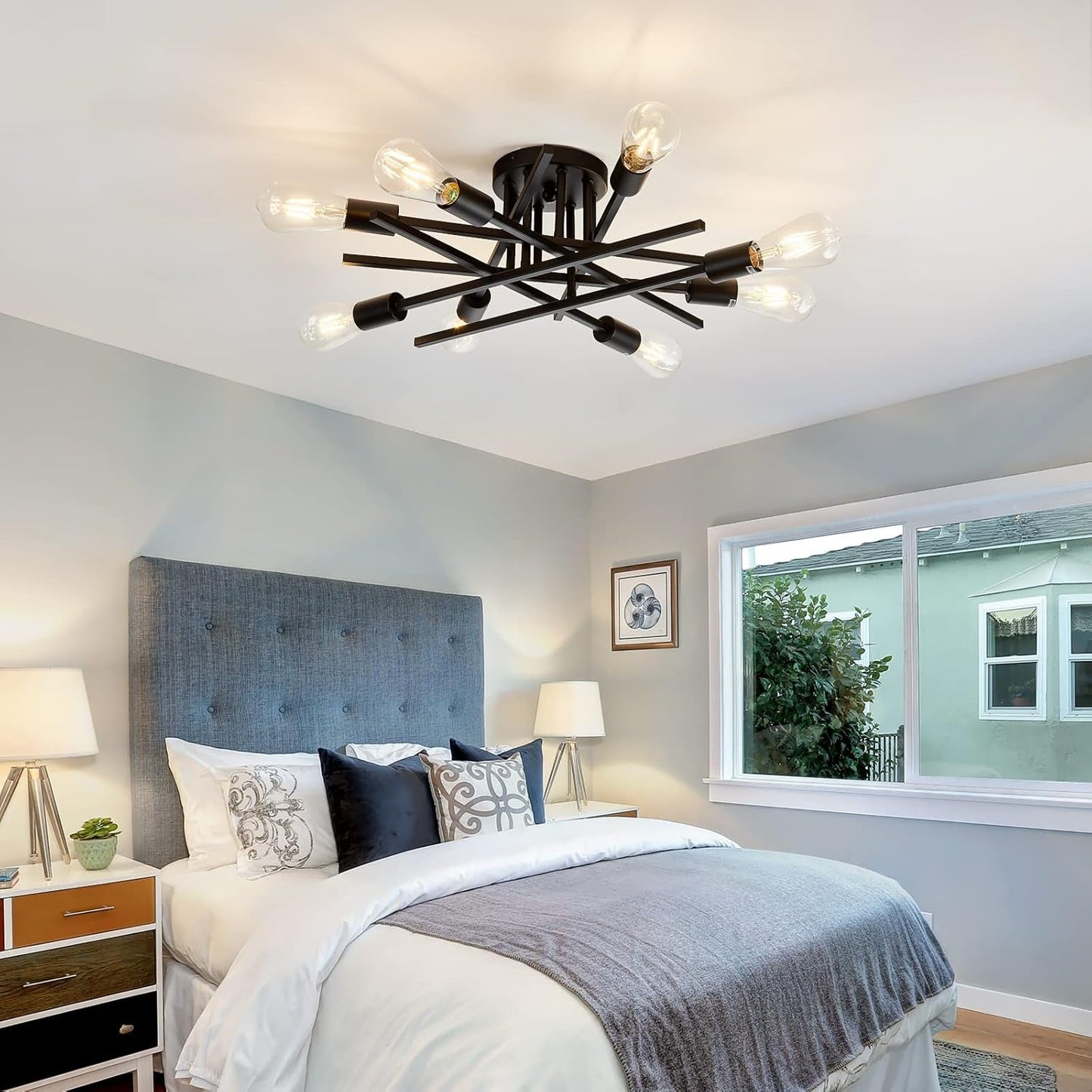 8 Light Matte Black Sputnik Chandelier Semi Flush Mount illuminating a modern bedroom with a stylish and inviting atmosphere.