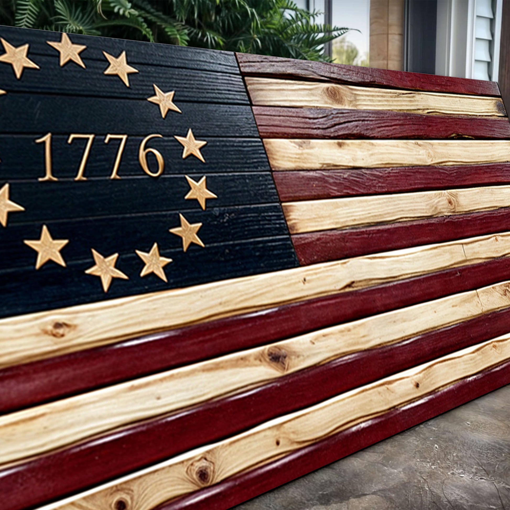 Wooden American flag with '1776' and stars, displayed outdoors.