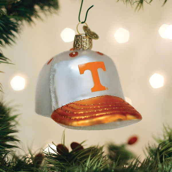 Tennessee Baseball Cap Ornament hanging on a tree with festive lights in the background.