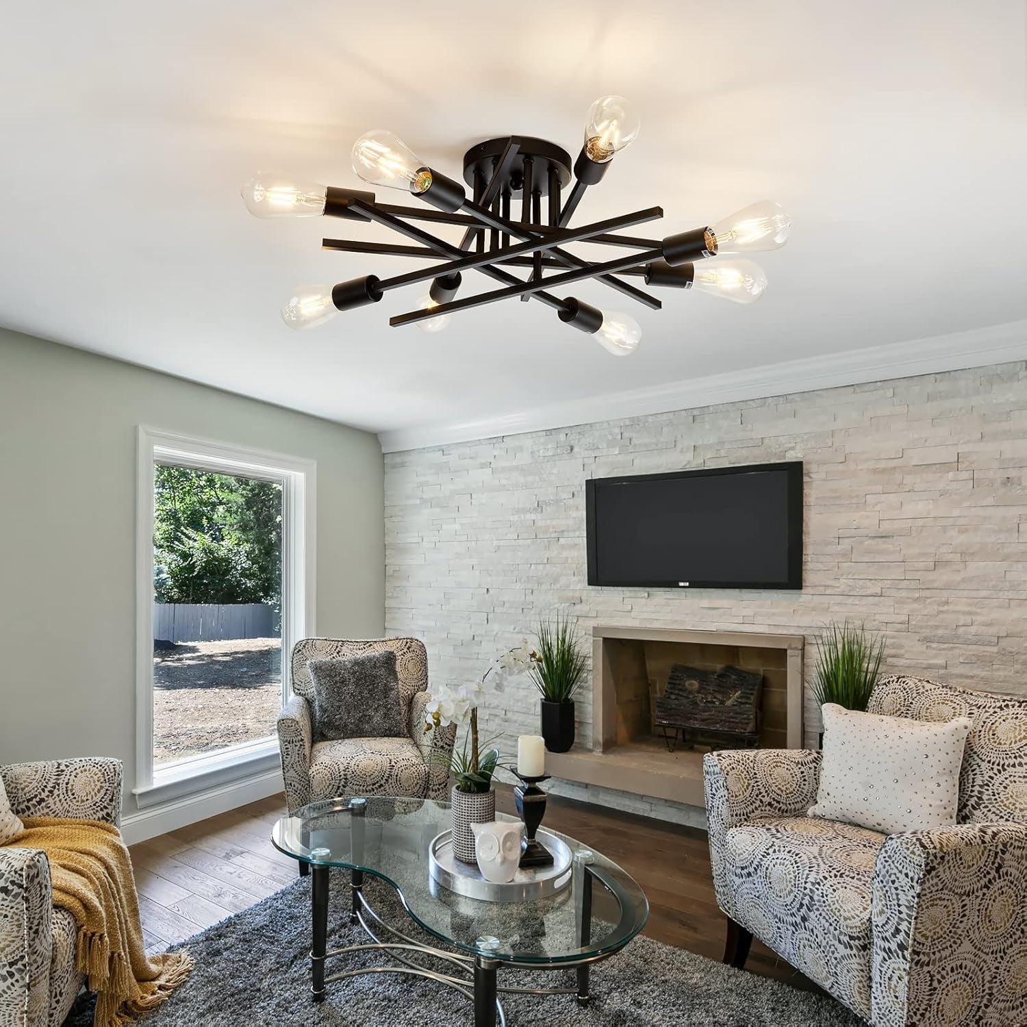 8 Light Matte Black Sputnik Chandelier Semi Flush Mount illuminating a stylish living area with modern decor.