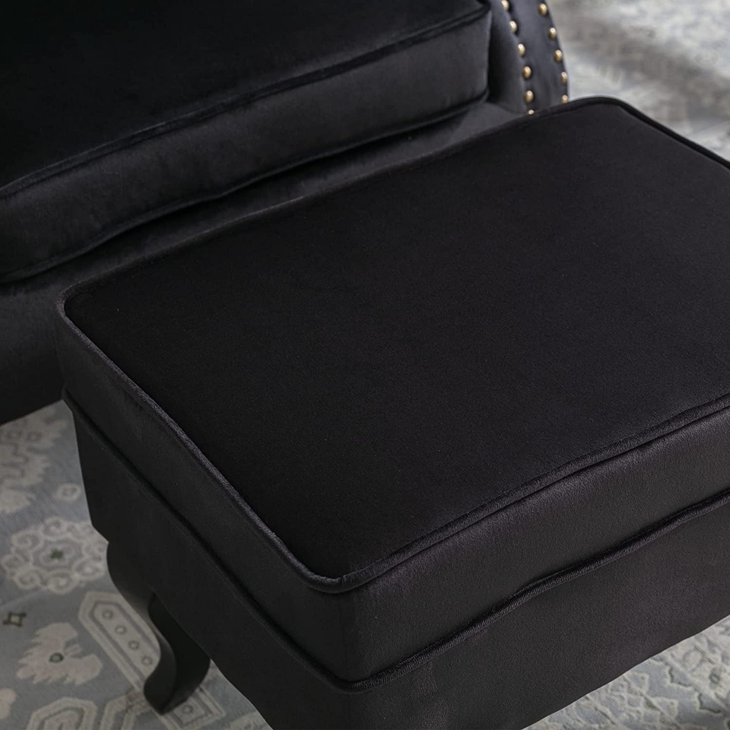 Elegant Black Velvet Wingback Chair With Ottoman Set - close-up of black ottoman cushion.