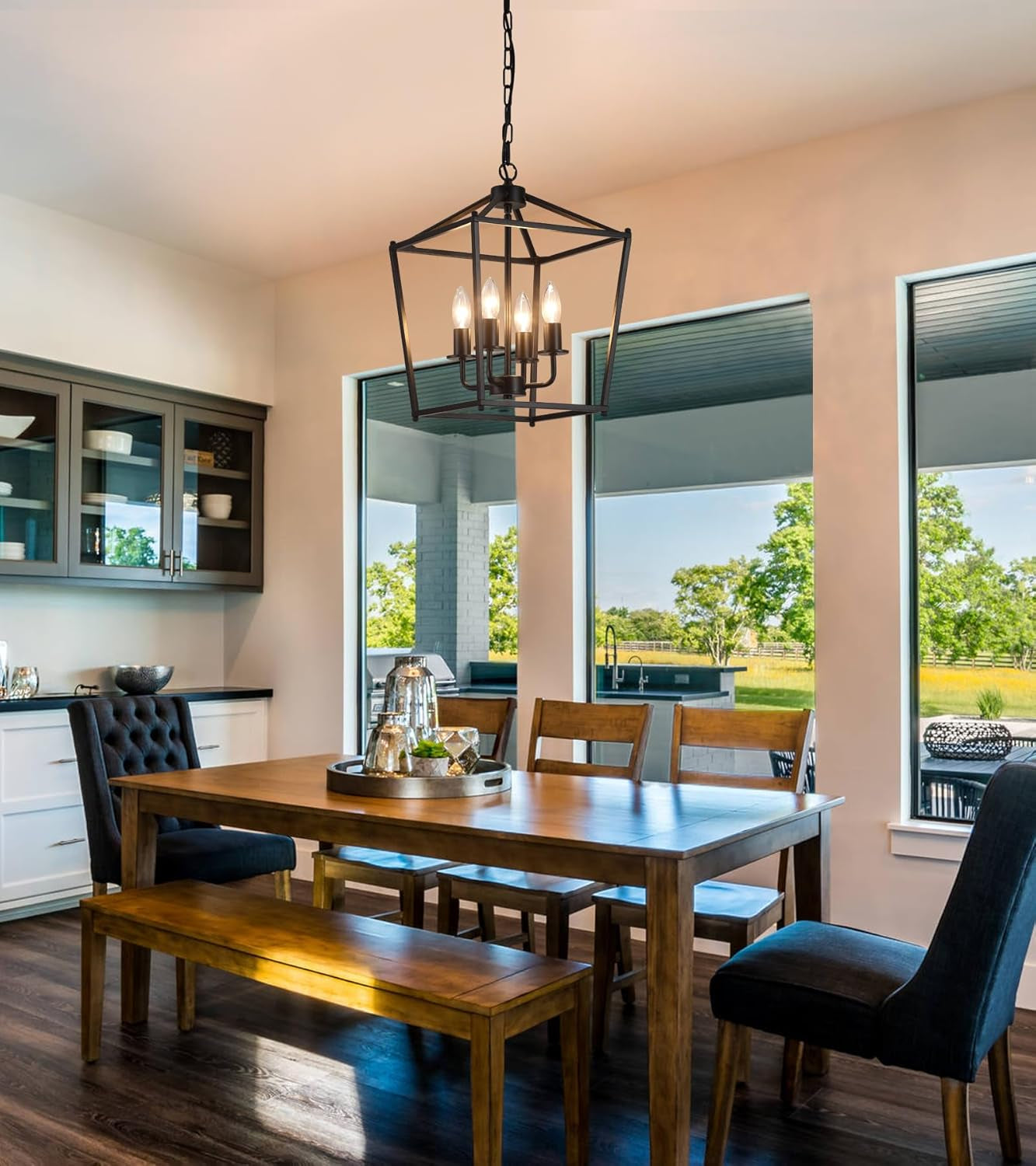 UL Black Industrial Lantern Chandelier 4 Light Pendant illuminating a stylish dining room with modern decor.