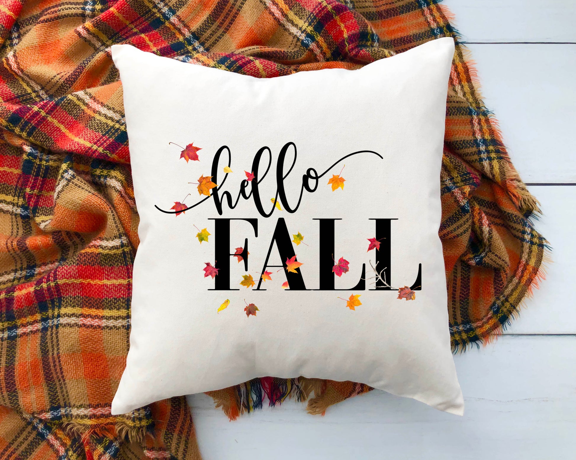 Hello Fall Pillow Cover 18x18 inch with colorful leaves on a cozy blanket.
