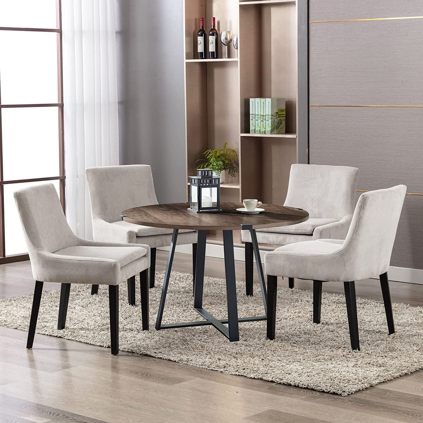 Beige Corduroy Dining Chairs With Wood Legs Set Of 6 around a round wooden table in a stylish dining area.