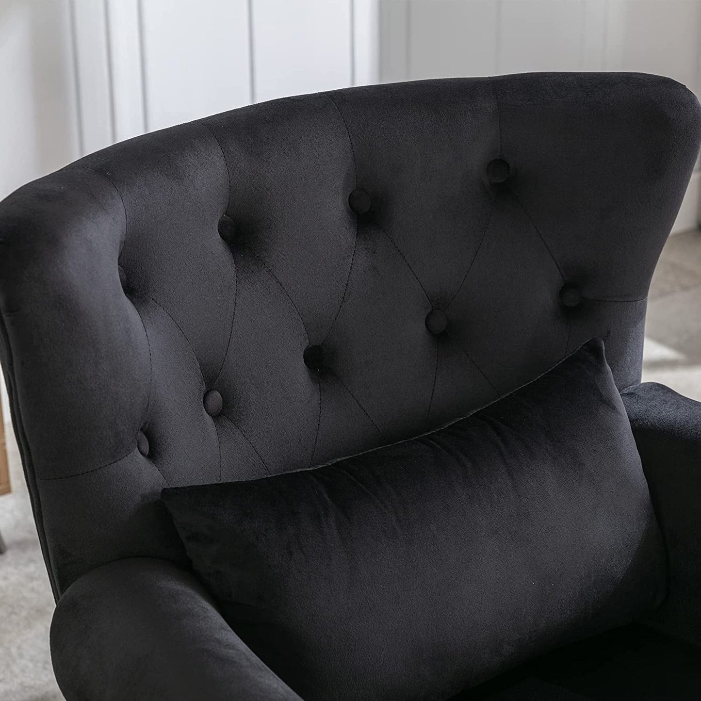 Elegant Black Velvet Wingback Chair With Ottoman Set featuring a tufted back and soft black velvet upholstery.