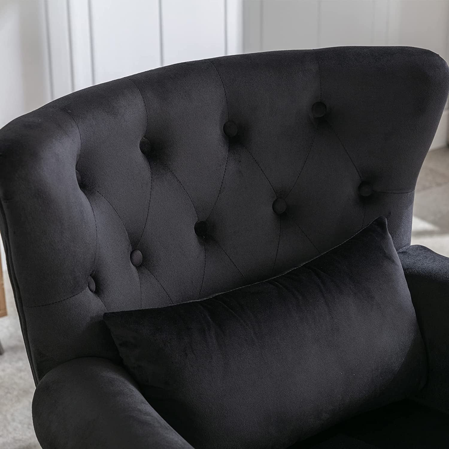 Elegant Black Velvet Wingback Chair With Ottoman Set featuring a tufted back and soft black velvet upholstery.