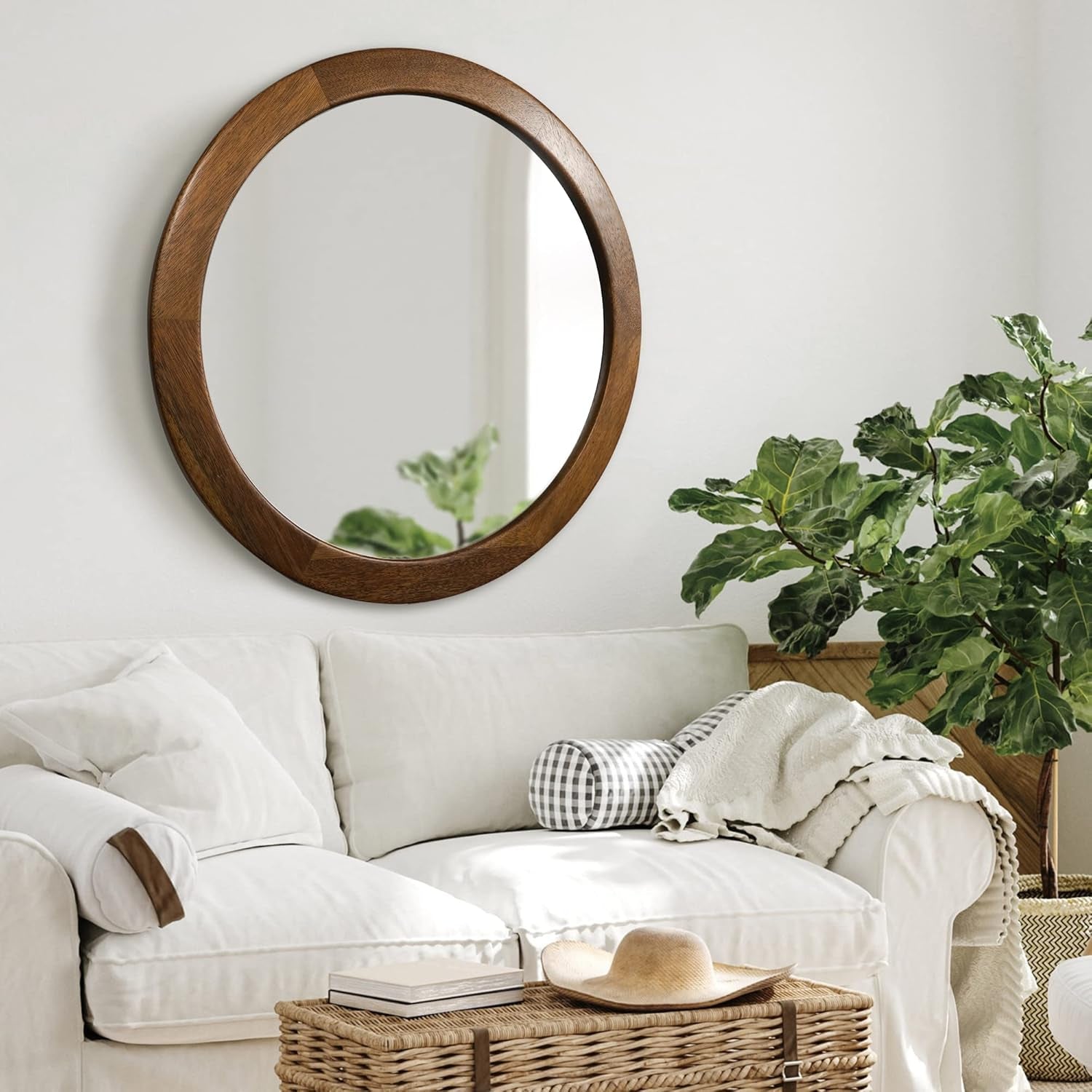 30 Inch Walnut Round Wall Mirror Rustic Style hanging above a cozy white couch in a stylish living room