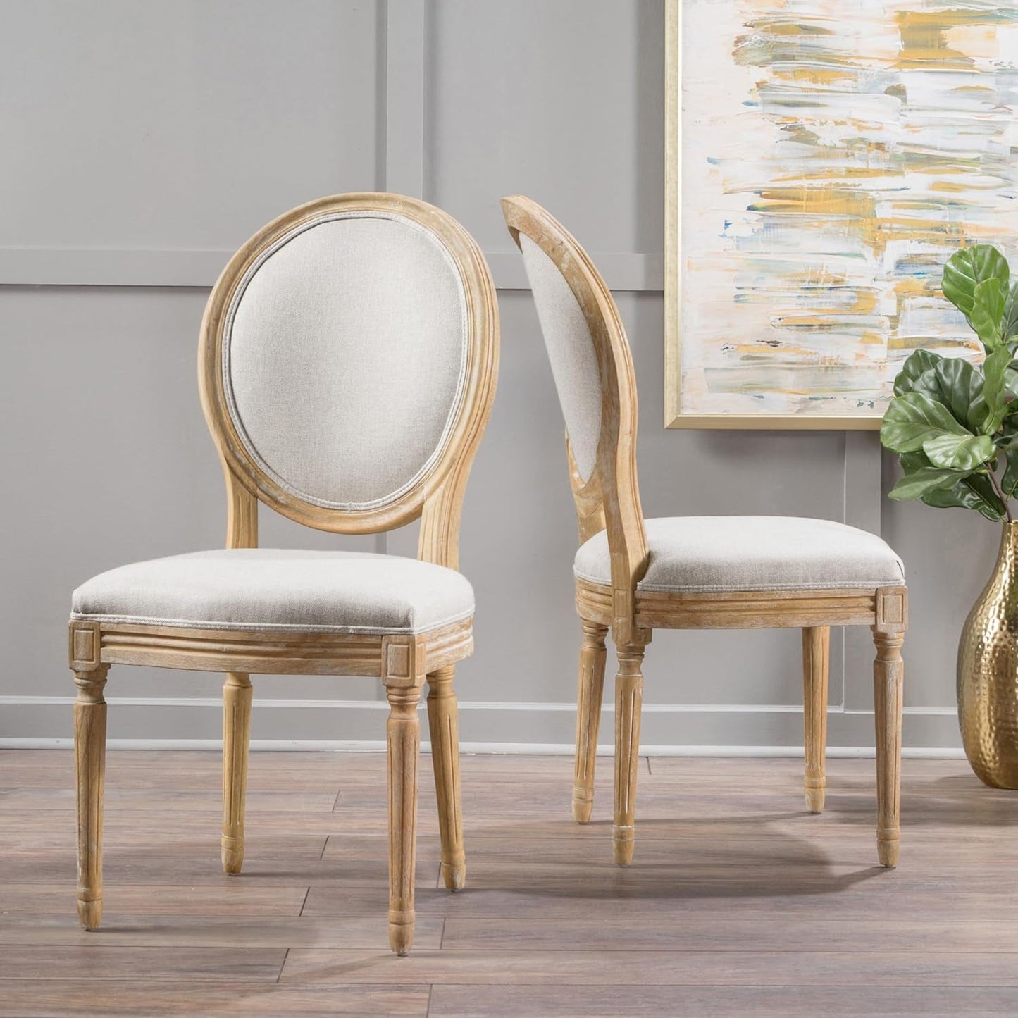 Phinnaeus Beige Polyester Fabric Dining Chairs Set Of 2 showcasing elegant design and comfort in a stylish dining room setting.