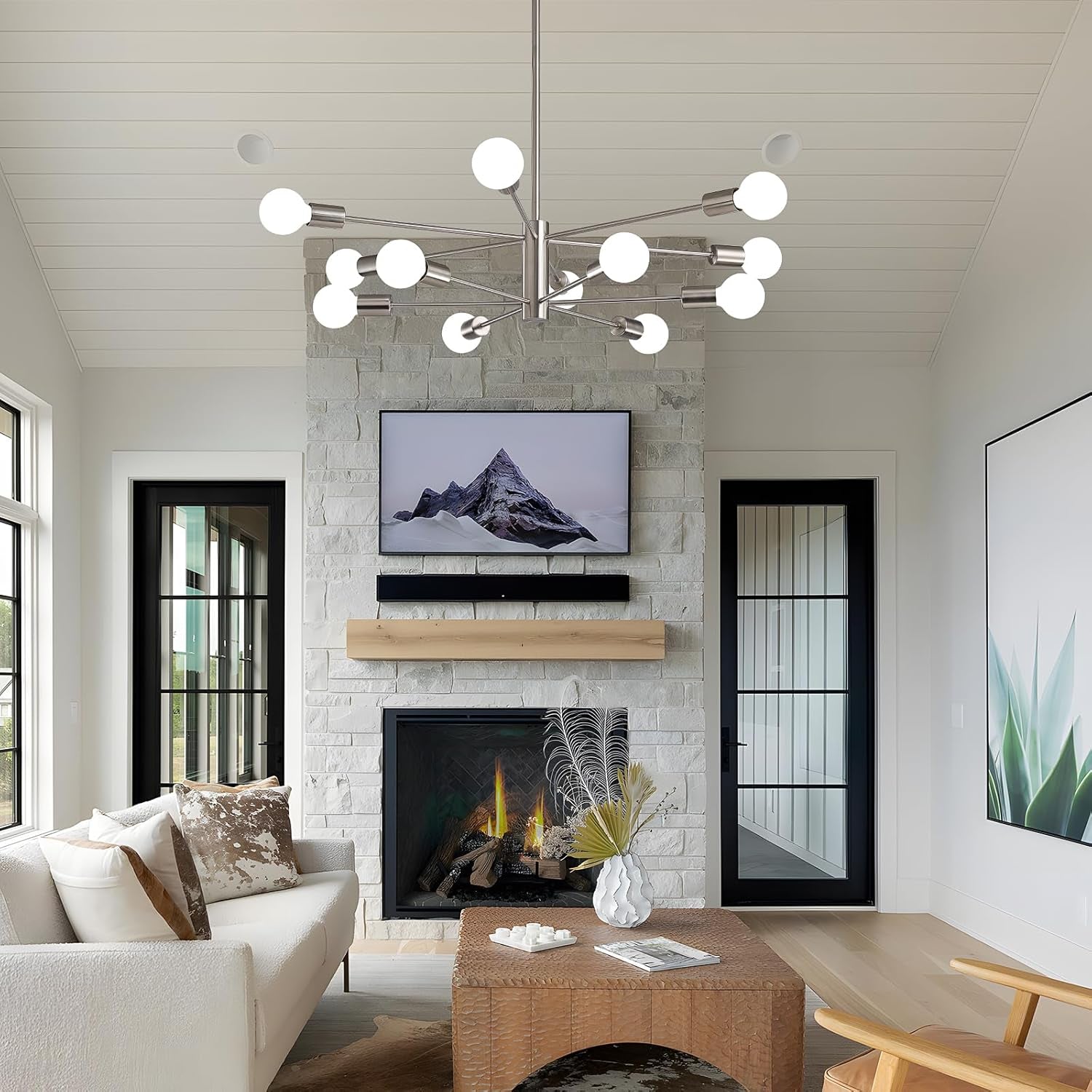 Sputnik 12 Light Brushed Nickel Chandelier For Dining Room illuminating a modern living space with a cozy fireplace.