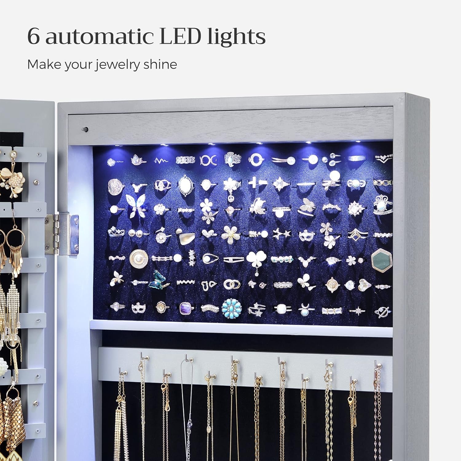 Tall Lockable Jewelry Cabinet With Mirror Gray showcasing 6 automatic LED lights illuminating organized jewelry.