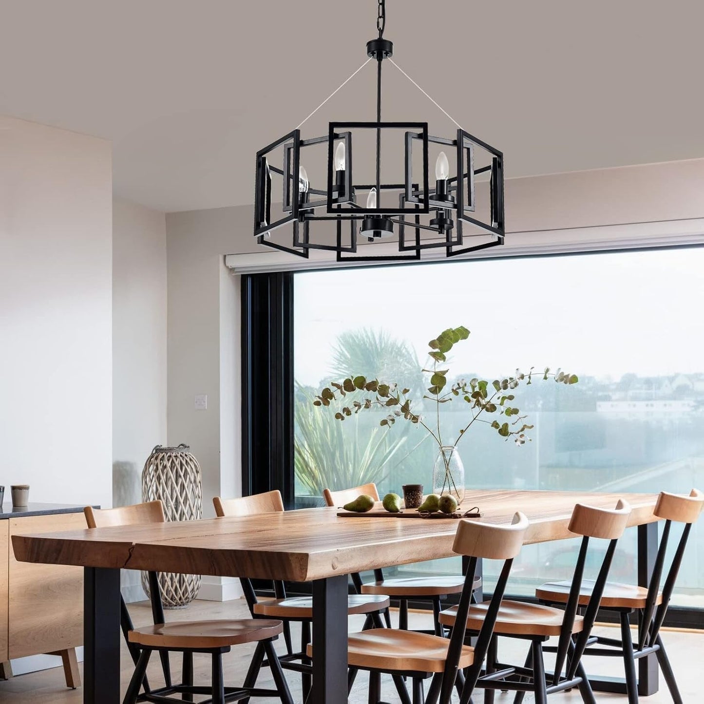 Industrial Style Five Light Matte Black Pendant Chandelier illuminating a modern dining room, enhancing its aesthetic.