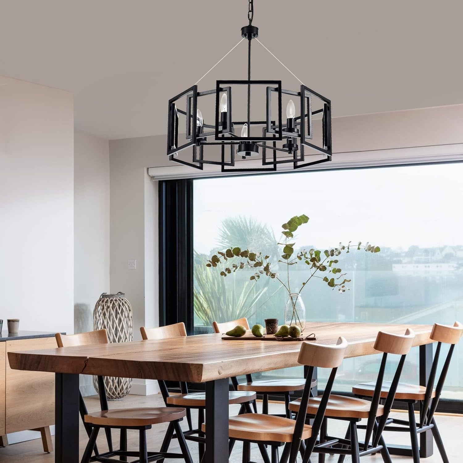 Industrial Style Five Light Matte Black Pendant Chandelier illuminating a modern dining room, enhancing its aesthetic.