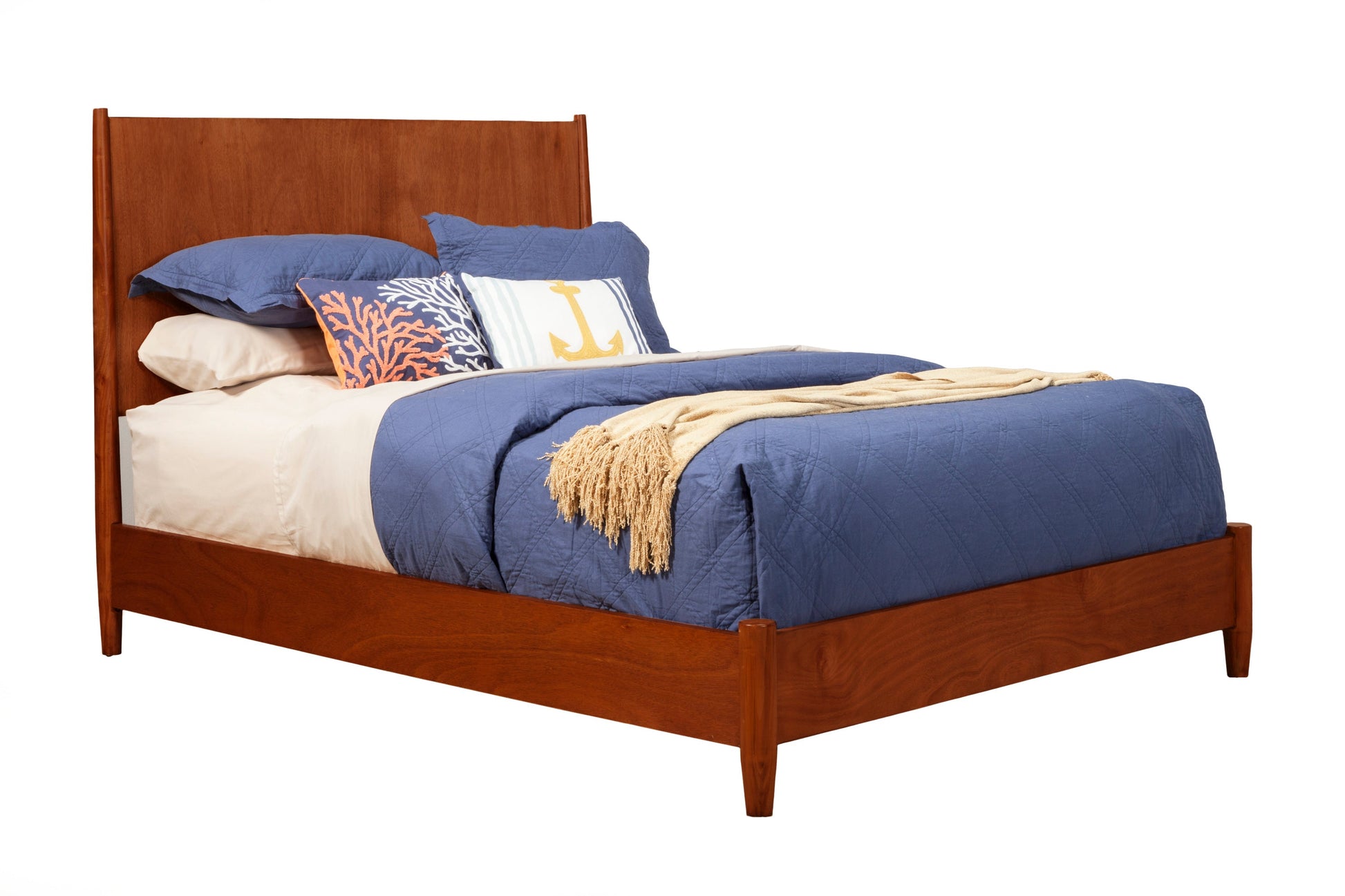 Flynn Panel Bed in Chestnut finish with blue bedding and decorative pillows on a white background.