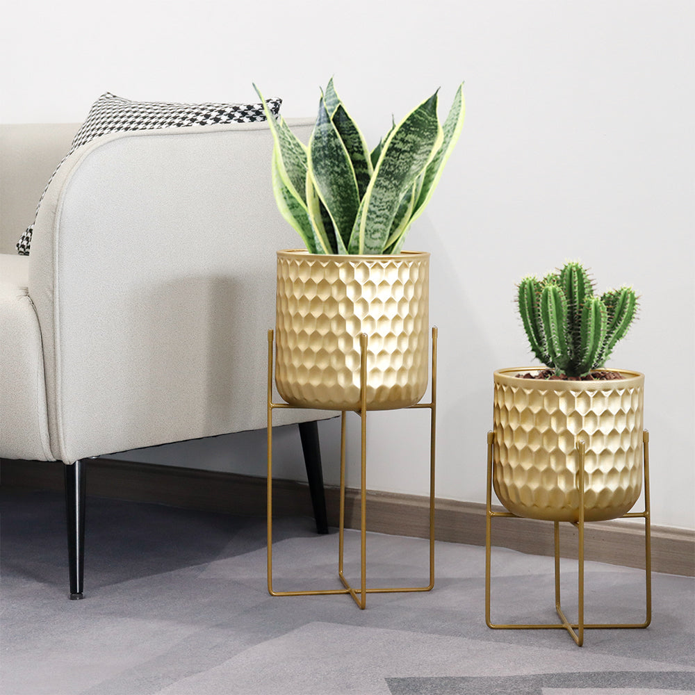 2 Set of 17&12 Inch Tall Planters With Stand Gold showcasing modern decor with plants.