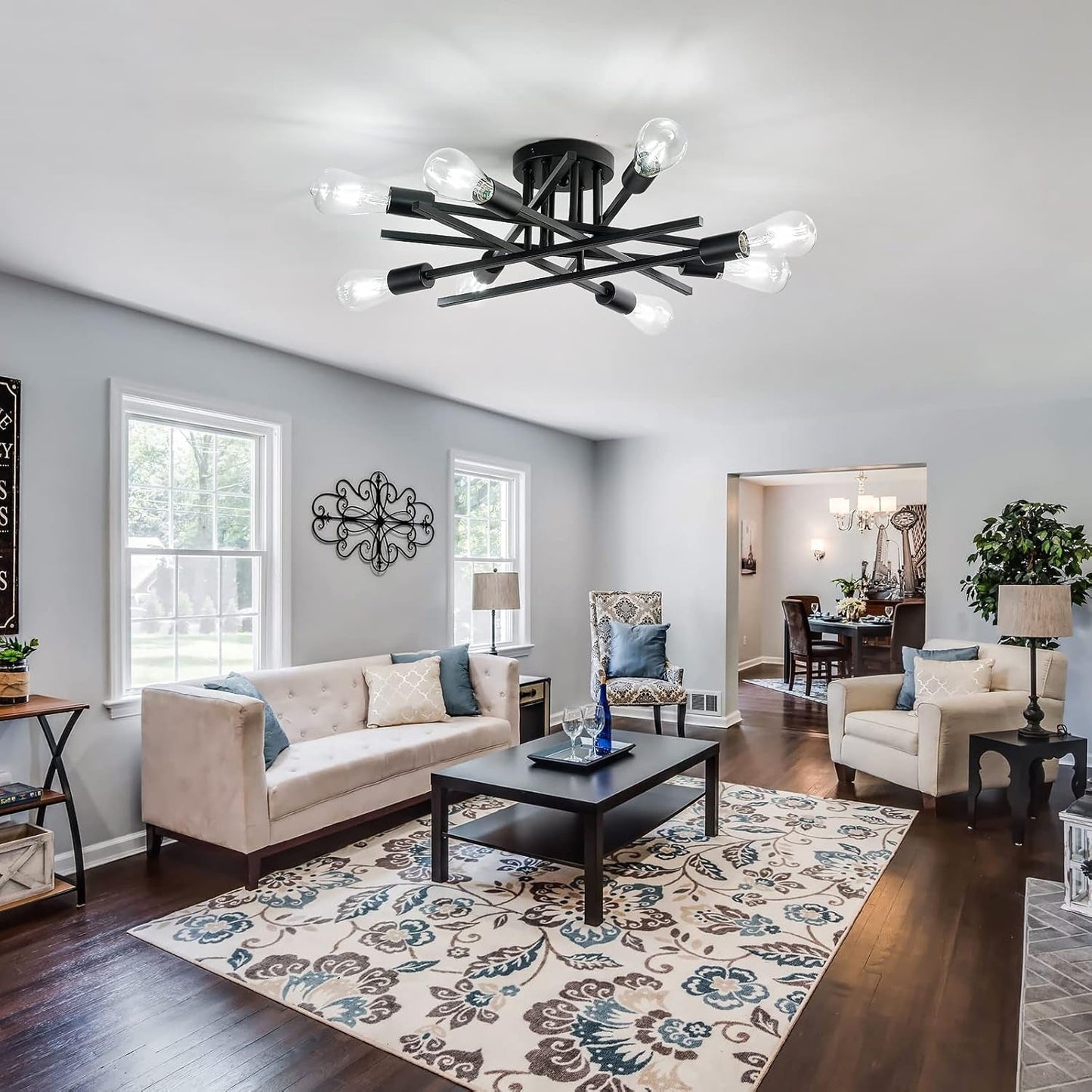 8 Light Matte Black Sputnik Chandelier Semi Flush Mount in modern living room setting with cozy decor.