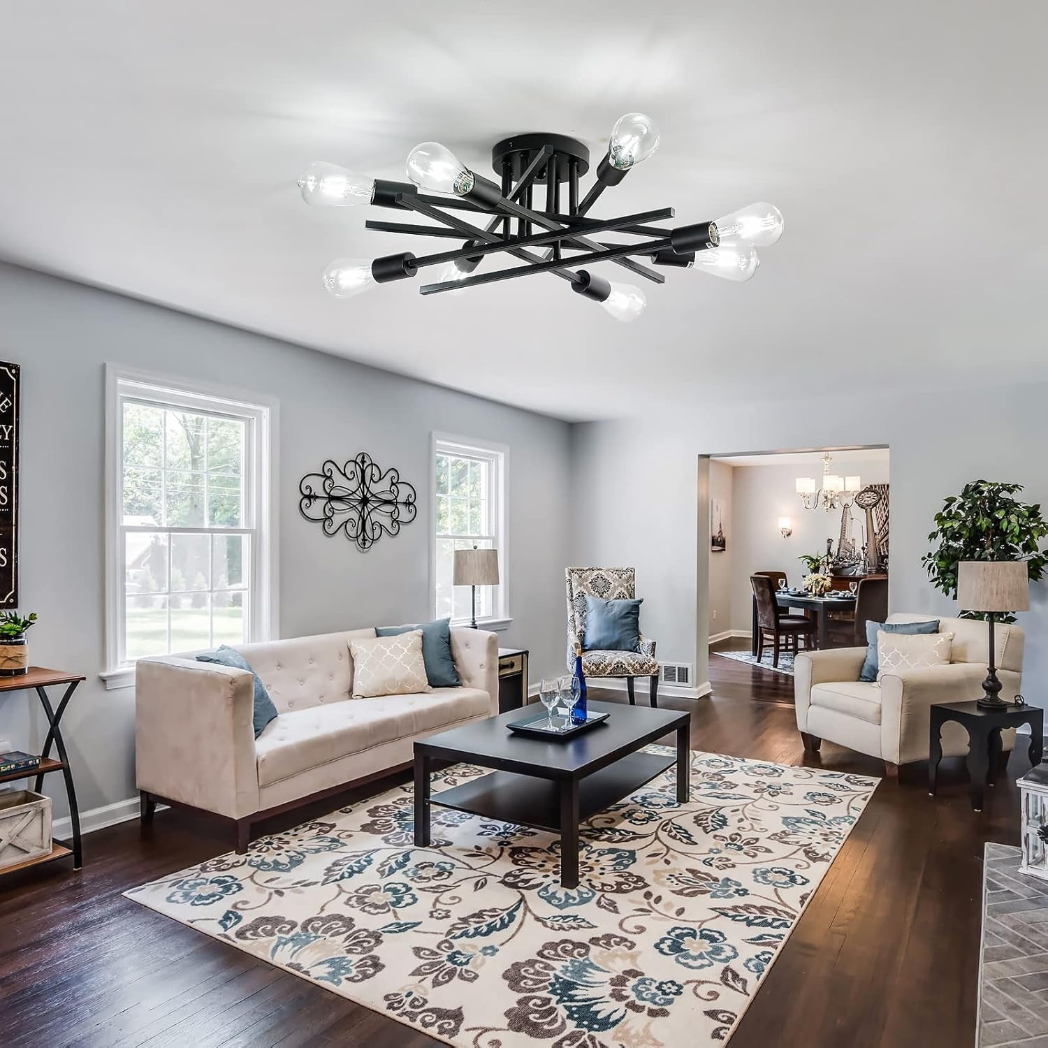 8 Light Matte Black Sputnik Chandelier Semi Flush Mount in modern living room setting with cozy decor.