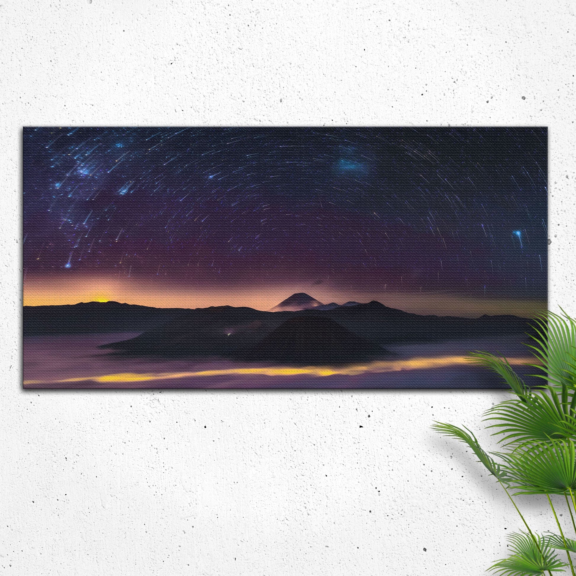 Starry night sky over mountains with a plant on a white background