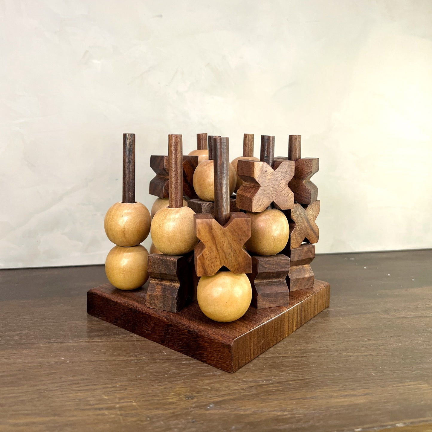 Kanan 3D Tic Tac Toe game featuring hand-carved wooden pieces in a 3D peg design, crafted from Indian rosewood.