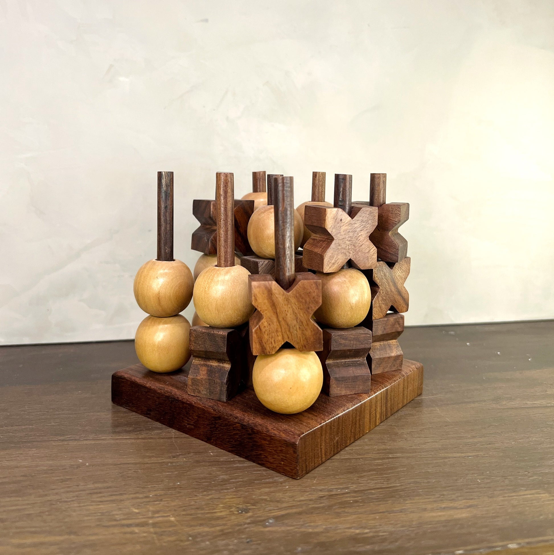 Kanan 3D Tic Tac Toe game featuring hand-carved wooden pieces in a 3D peg design, crafted from Indian rosewood.